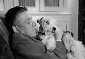 Francis Poulenc and his fox terrier at his home in France 